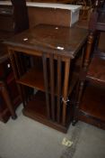 An Edwardian mahogany revolving bookcase (af)