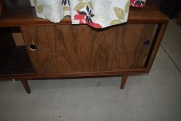 A vintage stained frame record or similar cabinet, with sliding doors