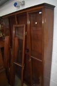 A late Victorian or Edwardian mahogany full height book case of narrow proportions, width approx.
