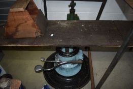 A motorcycle lift, having hydraulic repurposed barbers/dentist chair base