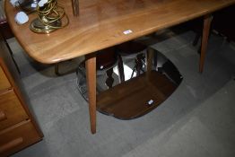 An Ercol dining table on splay legs, approx 145 x 76cm
