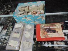 A box of Cigarette Cards, loose and in albums, many makers seen, many hundreds