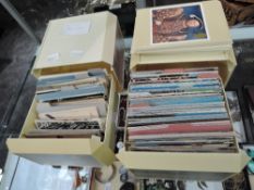 A collection in two plastic pull out storage boxes containing Vintage and modern Postcards, Street