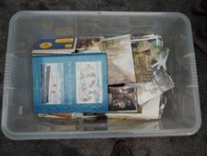 A very large box of mainly modern Postcards, GB & World along with a volume, The Dictionary of