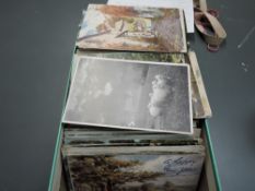 A shoe box of modern and vintage Postcards, various