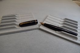 A Mabie Todd & Co Swan 3220 Self Filler Leverfill, in dark blue with two bands to the cap and a Swan