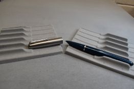 A Parker 51 fountain pen in teal blue with steel cap. Approx 13.5cm