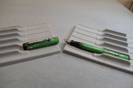 A Platignum leverfill fountain pen in green and cream with threaded base to barrel to hold cap