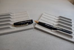 A Wyvern Perfect leverfill fountain pen in blue/black marble with single narrow band to the cap
