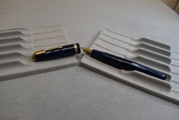 A Parker Duofold fountain pen in blue with broad decorative band to cap with Parker Duofold N nib.