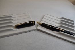 A Burnham 48 leverfill fountain pen in black with single band to cap having Burnham B45 Medium