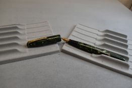 A Conway Stewart 15 leverfill fountain pen in green marble having a Conway Stewart 1A nib. Approx