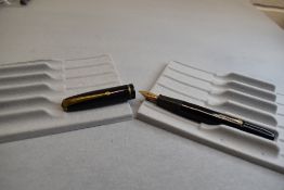 A Conway Stewart 28 leverfil fountain pen in black with single narrow band to the cap having a