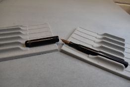 A Conway Stewart 300 leverfil fountain pen in black with clipless cap having a Conway Stewart 5 nib.