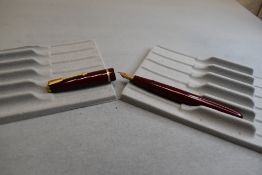 A Parker Slimfold fountain pen in burgundy with single decorative band to cap with Parker 5 nib.