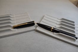A Parker 45 vacuum fill fountain pen in black. Approx 13.6cm
