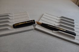 A Wyvern 60 leverfill fountain pen in black with single narrow band to the cap having Wyvern Perfect