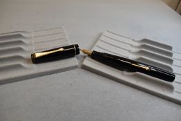 A Wyvern 80 leverfill fountain pen in black with single narrow band to the cap having Warrented nib.