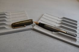 A Mabie Todd & Co Swan Self Filler Leverfill, in grey with two bands to the cap and a Swan No2