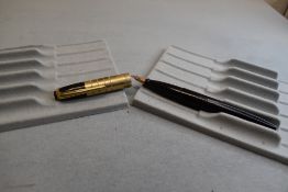 A Wyvern 303 plunger fill fountain pen in black with single large band to the cap having Wyvern nib.