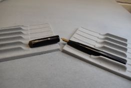 A Conway Stewart Universal 479 leverfil fountain pen in black a Conway Stewart 14k nib. Approx 13cm