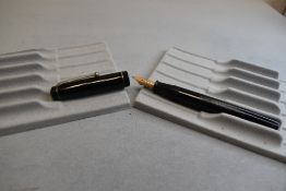 A Wyvern 60C leverfill fountain pen in black with single narrow band to the cap having Wyvern