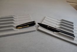 A Parker 17 fountain pen in black with narrow band to the cap. Approx 13.2cm