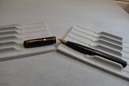 A Conway Stewart 286 leverfill fountain pen in black with single narrow band to cap having Conway