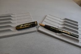 A Conway Stewart 28 leverfill fountain pen in green hatched design with a narrow band to cap