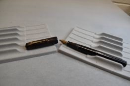 A Conway Stewart 475 leverfil fountain pen in black a Conway Stewart 14k nib. Approx 13.2cm