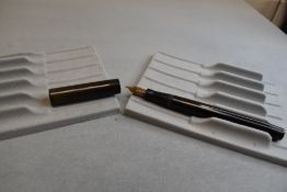 A Mabie Todd & Co Self Filler leverfill fountain pen in BHR (turned brown), with a Swan 2 14ct