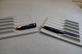 A Parker Slimfold fountain pen in blue with narrow decorative band to the cap and having a Parker