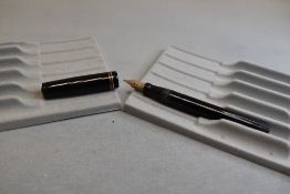 A Mabie Todd & Co Swan L112/60 Leverless twist filler, in black with two bands to clipless cap and a