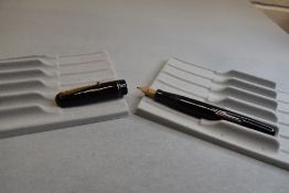 A Mabie Todd & Co Swan 3260 Self Filler Leverfill, in black with two bands to the cap and a Swan No2