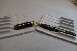 A Conway Stewart 55 leverfill fountain pen in grey marble with one broad and two narrow bands to the