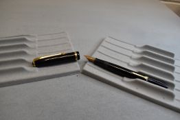 A Conway Stewart 12 leverfill fountain pen in black with single band to the cap having Conway 14ct
