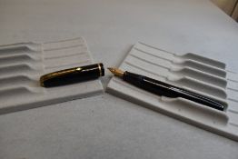 A Conway Stewart 28 leverfill fountain pen in black with one narrow band to the cap having a