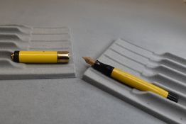 A Parker Lady Duofold fountain pen in Mandarin yellow with very broad band to the cap having a