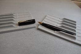 A Mabie Todd & Co Swan Leverless twist filler, in black and a Phillips, Oxford nib. Approx 12.7cm