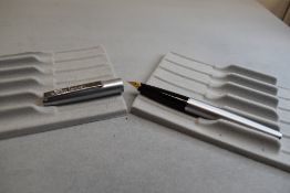 A Conway Stewart cartridge fountain pen in brushed steel
