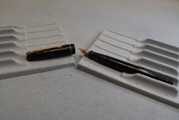 A Mabie Todd & Co Swan Leverless twist filler, in black with a single band to cap and a Swan No1K