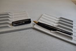 A Mabie Todd & Co Self filler leverfill fountain pen in black with chased design with Swan No2