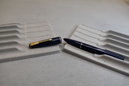A Parker 17 lady fountain pen in blue with narrow band to the cap. Approx 11.7cm
