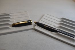 A Sheaffer Imperial I plunger fill fountain pen in grey with a single band to cap having a