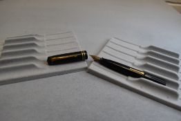 A boxed Conway Stewart leverfill fountain pen in black with two narrow bands to the cap having