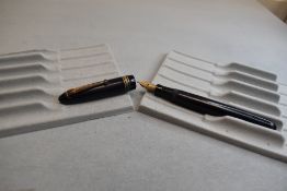 A Mabie Todd & Co Swan 4220 Leverless twist filler, in navy blue with two narrow and one broad
