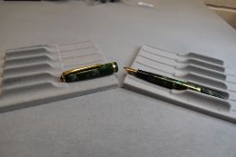 A Conway Stewart 12 leverfil fountain pen in green marble with single band to the cap having a