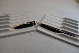 A Parker Slimfold fountain pen in black with single decorative band to cap with Parker 5 nib. Approx