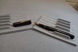 A National Security leverfill fountain pen in BHR having a warrented nib