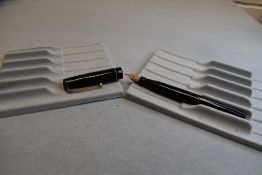 A Mabie Todd Swan 6160 Self-filler leverfill fountain pen in black with one broad band to cap having